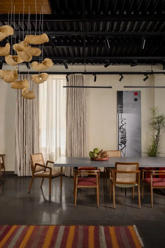 Studio dining area with woven chairs