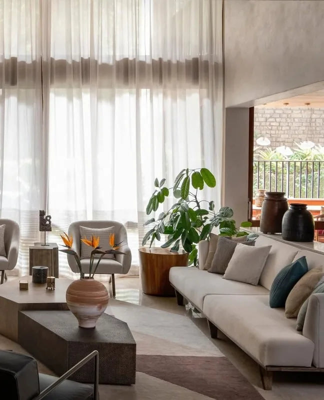 Sunlit living room with sheer curtains