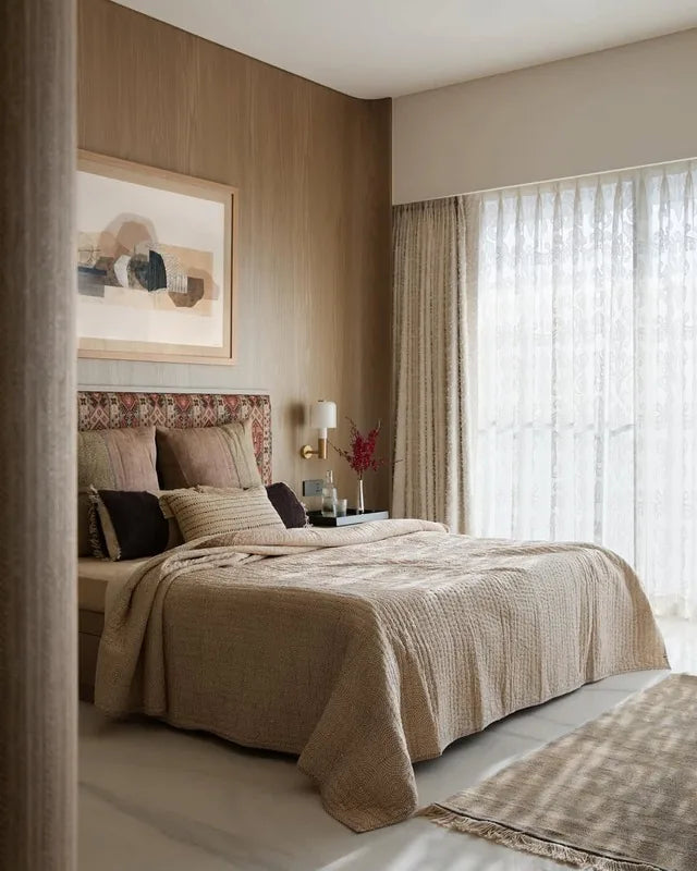Neutral bedroom with layered linens